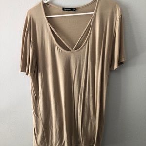 Tan short sleeve criss-cross top. Size 6 medium